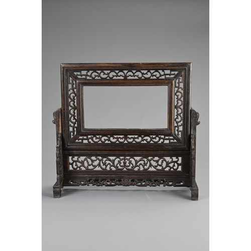 141 - TWO CHINESE WOODEN ITEMS. To include a rectangular tray with silk embroidered panels of birds under ... 