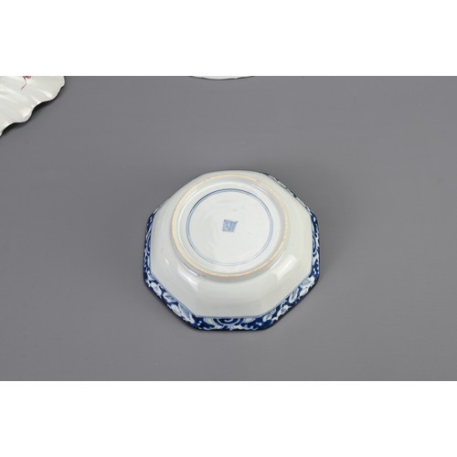 261 - EIGHT JAPANESE IMARI DISHES, MEIJI PERIOD AND LATER. Comprising: a fluted brocaded dish, 21.3cm wide... 