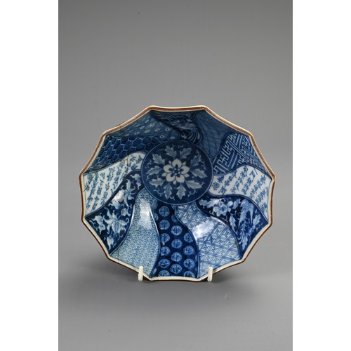 264 - A JAPANESE PORCELAIN BLUE AND WHITE FLUTED BOWL, BLUE SEAL MARK TO BASE AND A COVERED BOWL. The bowl... 