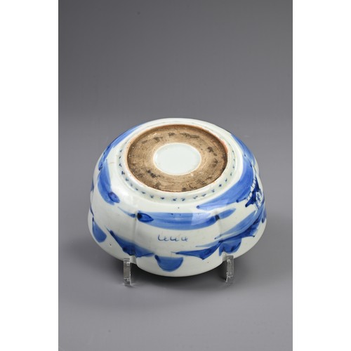 265 - THREE 19TH CENTURY JAPANESE PORCELAIN BLUE AND WHITE LOBED GRADUATED BOWLS AND A GILT BOWL AND COVER... 