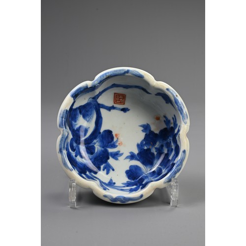 265 - THREE 19TH CENTURY JAPANESE PORCELAIN BLUE AND WHITE LOBED GRADUATED BOWLS AND A GILT BOWL AND COVER... 