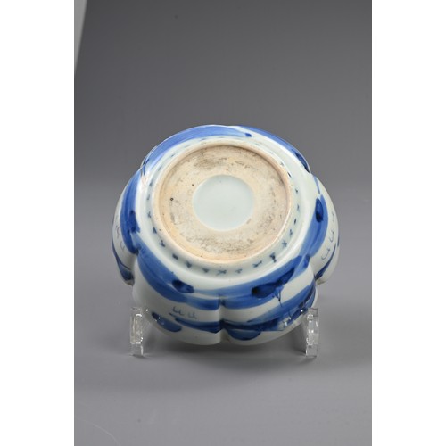 265 - THREE 19TH CENTURY JAPANESE PORCELAIN BLUE AND WHITE LOBED GRADUATED BOWLS AND A GILT BOWL AND COVER... 