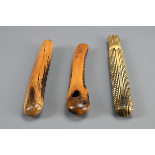 296 - THREE JAPANESE EDO PERIOD STAG-ANTLER PIPE CASES (KISERUZUTSU), 19th century, Two of otoshi-zutsu fo... 