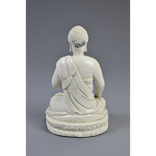 104 - A CHINESE DEHUA PORCELAIN FIGURE OF BUDDHA, LATE MING DYNASTY. The figure dressed in robes seated on... 