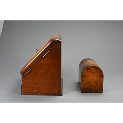 355 - AN EDWARDIAN WALNUT STATIONARY BOX AND A 19TH CENTURY DOMED RECTANGULAR TEA CADDY. The hinged statio... 