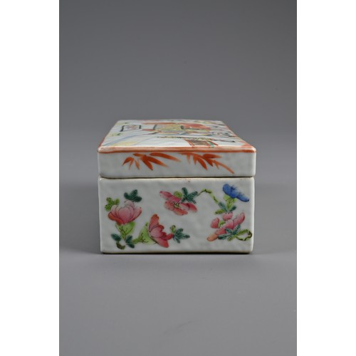 154 - A CHINESE FAMILLE ROSE PEN BOX AND COVER, 19TH CENTURY. Of rectangular form with two compartments to... 