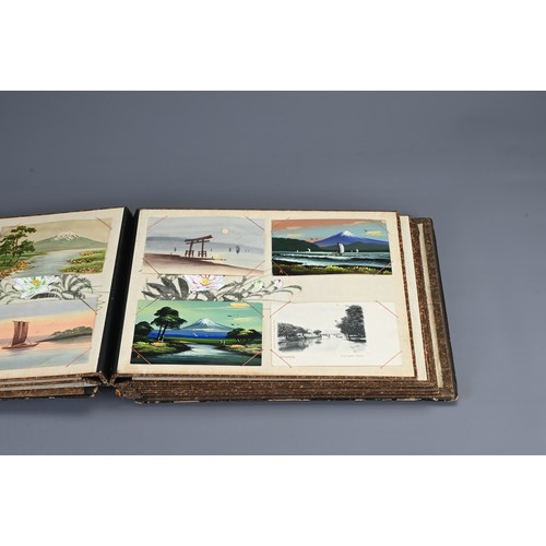 258 - TWO JAPANESE BLACK LACQUERED PHOTO ALBUMS, EARLY 20TH CENTURY. Each album with nine pages holding po... 