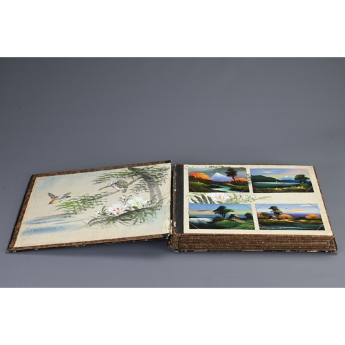 258 - TWO JAPANESE BLACK LACQUERED PHOTO ALBUMS, EARLY 20TH CENTURY. Each album with nine pages holding po... 