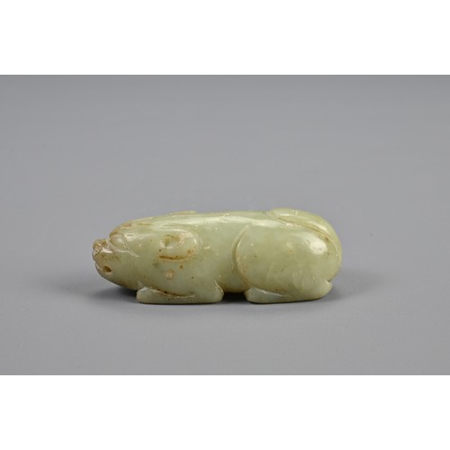 109 - A CHINESE CELADON JADE RECUMBENT BOAR PENDANT, 18/19TH CENTURY. Dense jade carved in the form of a b... 