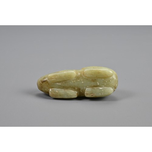 109 - A CHINESE CELADON JADE RECUMBENT BOAR PENDANT, 18/19TH CENTURY. Dense jade carved in the form of a b... 