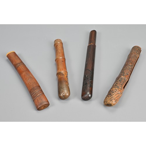 295 - FOUR JAPANESE EDO PERIOD PIPE CASES (KISERUZUTSU), 19th Century, Comprising one of wood, of otoshi-z... 