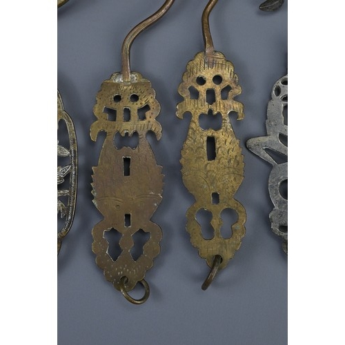 86 - A GROUP OF SIX CHINESE METALWARE BIRDCAGE HOOKS, EARLY 20TH CENTURY. With pierced sections depicting... 