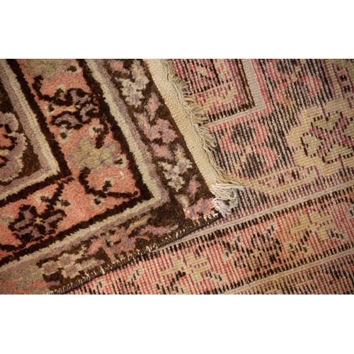 193 - A SINO CHINESE WOOL PILE RUG, 20TH CENTURY. Decorated with geometric and floral motifs. 275cm x 144c... 