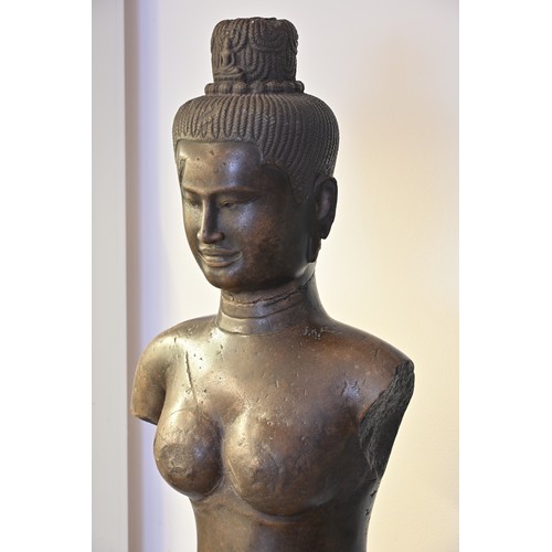 182 - A VERY LARGE AND HEAVY CARVED GREY STONE FIGURE OF FEMALE DEITY, KHMER BAPHUON STYLE. Fitted onto a ... 