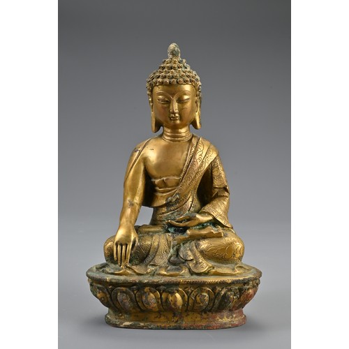 188 - A TRIO OF TIBETAN BRONZE SEATED BUDDHAS ON STAND. The deities dressed in robes adorned with jewels o... 