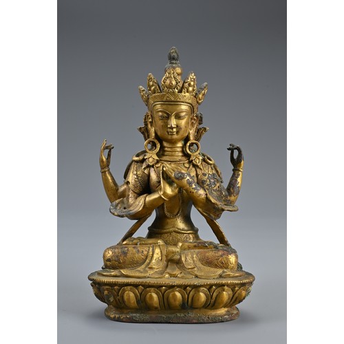 188 - A TRIO OF TIBETAN BRONZE SEATED BUDDHAS ON STAND. The deities dressed in robes adorned with jewels o... 