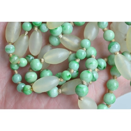 113 - A JADE JADEITE BEADED NECKLACE WITH PENDANTS, 19/20TH CENTURY. Comprising a carved and pierced jadei... 