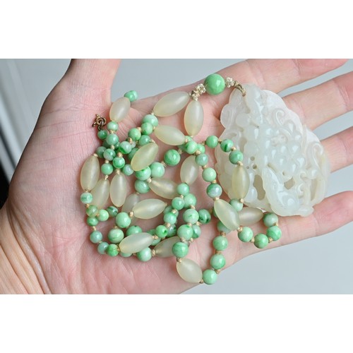 113 - A JADE JADEITE BEADED NECKLACE WITH PENDANTS, 19/20TH CENTURY. Comprising a carved and pierced jadei... 