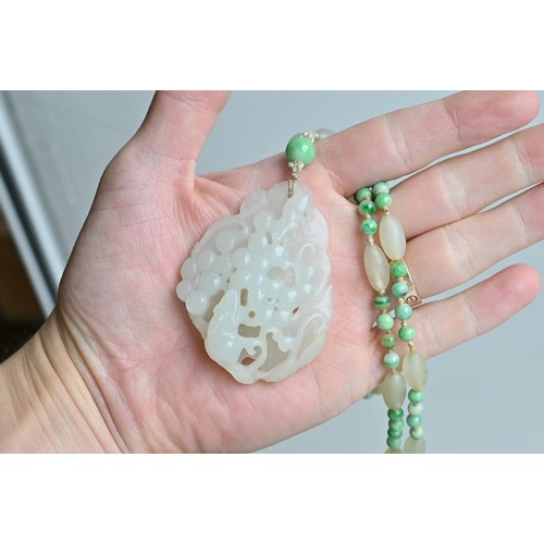 113 - A JADE JADEITE BEADED NECKLACE WITH PENDANTS, 19/20TH CENTURY. Comprising a carved and pierced jadei... 