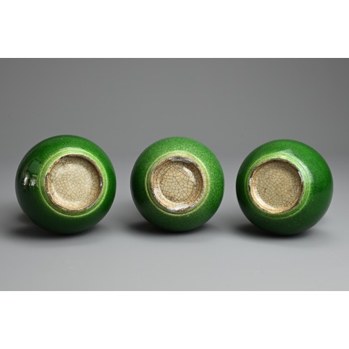 1 - THREE CHINESE GREEN CRACKLE GLAZED PORCELAIN VASES, LATE QING / REPUBLIC PERIOD. Each of double gour... 