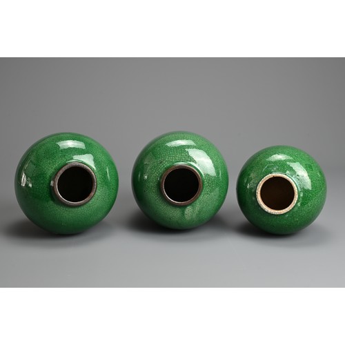 2 - THREE CHINESE GREEN CRACKLE GLAZED PORCELAIN JARS, LATE QING / REPUBLIC PERIOD. Of graduating sizes ... 