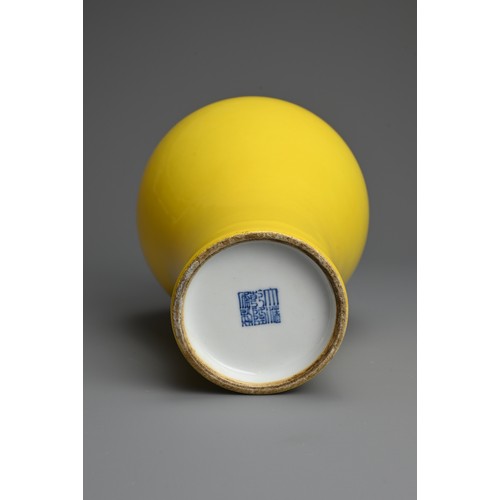 329 - A CHINESE YELLOW GLAZED PORCELAIN MEIPING VASE, 20TH CENTURY. Covered in a bright even yellow glaze ... 