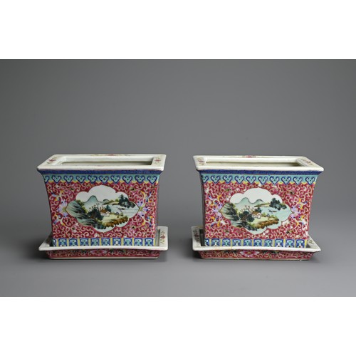 28 - A PAIR OF CHINESE RUBY GROUND AND FAMILLE ROSE DECORATED PORCELAIN JARDINIERES ON STANDS, 20TH CENTU... 