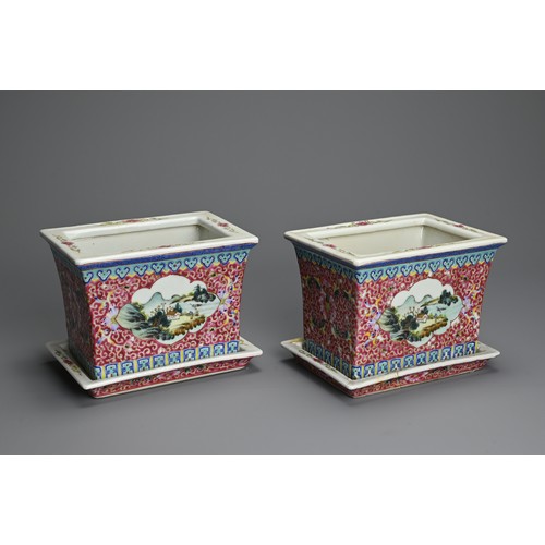 28 - A PAIR OF CHINESE RUBY GROUND AND FAMILLE ROSE DECORATED PORCELAIN JARDINIERES ON STANDS, 20TH CENTU... 