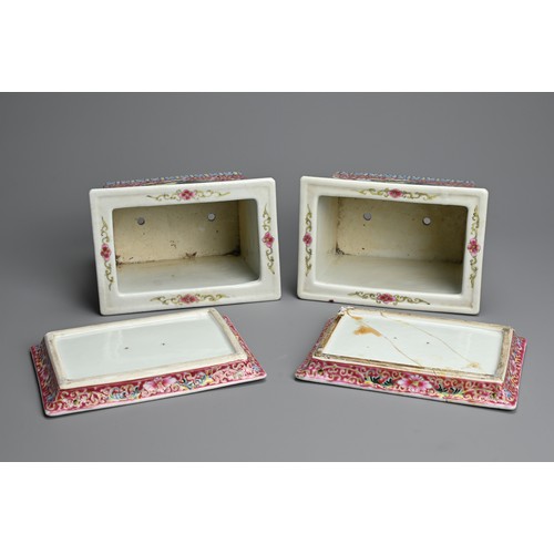 28 - A PAIR OF CHINESE RUBY GROUND AND FAMILLE ROSE DECORATED PORCELAIN JARDINIERES ON STANDS, 20TH CENTU... 