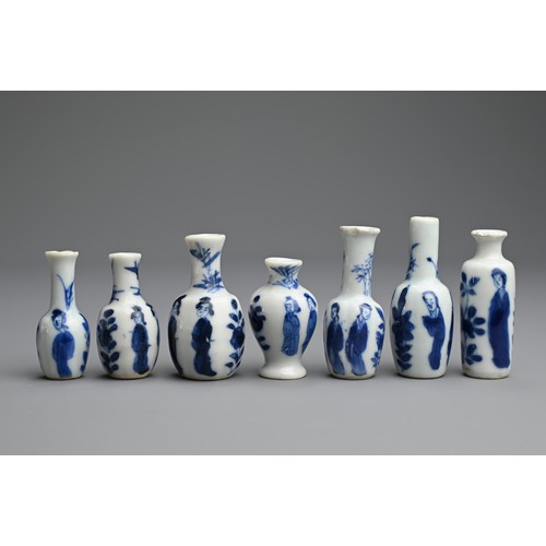 78 - A GROUP OF CHINESE BLUE AND WHITE DOLL'S HOUSE MINIATURE PORCELAIN VASES, EARLY 18TH CENTURY. Seven ... 