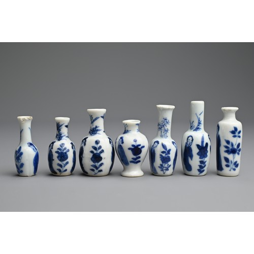 78 - A GROUP OF CHINESE BLUE AND WHITE DOLL'S HOUSE MINIATURE PORCELAIN VASES, EARLY 18TH CENTURY. Seven ... 