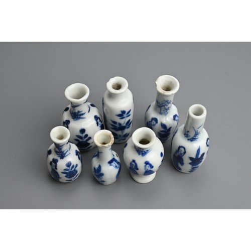 78 - A GROUP OF CHINESE BLUE AND WHITE DOLL'S HOUSE MINIATURE PORCELAIN VASES, EARLY 18TH CENTURY. Seven ... 