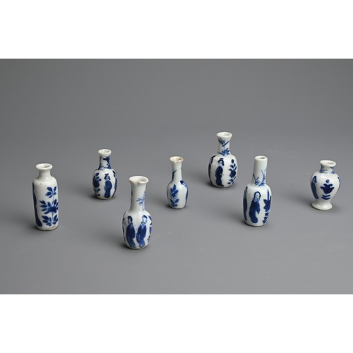 78 - A GROUP OF CHINESE BLUE AND WHITE DOLL'S HOUSE MINIATURE PORCELAIN VASES, EARLY 18TH CENTURY. Seven ... 