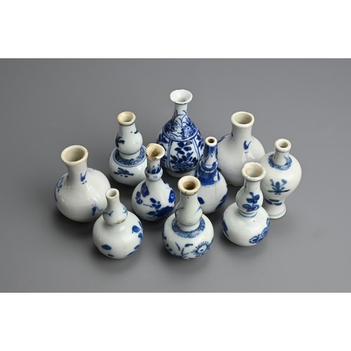 79 - A GROUP OF CHINESE BLUE AND WHITE PORCELAIN DOLL'S HOUSE MINIATURE VASES, EARLY 18TH CENTURY. Ten va... 