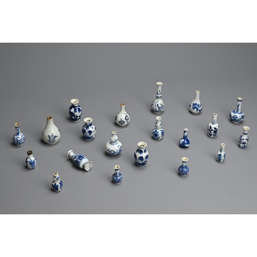 80 - A GROUP OF CHINESE BLUE AND WHITE DOLL'S HOUSE MINIATURE PORCELAIN VASES, 18TH CENTURY. Twenty vases... 