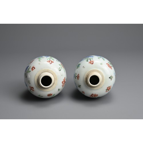 43 - A PAIR OF CHINESE WUCAI PORCELAIN OVIFORM JARS, EARLY 18TH CENTURY. Decorated with flowering branche... 