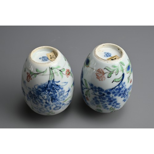 43 - A PAIR OF CHINESE WUCAI PORCELAIN OVIFORM JARS, EARLY 18TH CENTURY. Decorated with flowering branche... 