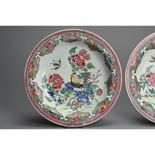 50 - A LARGE PAIR OF CHINESE FAMILLE ROSE PORCELAIN ROOSTER DISHES, EARLY 18TH CENTURY. With rounded side... 