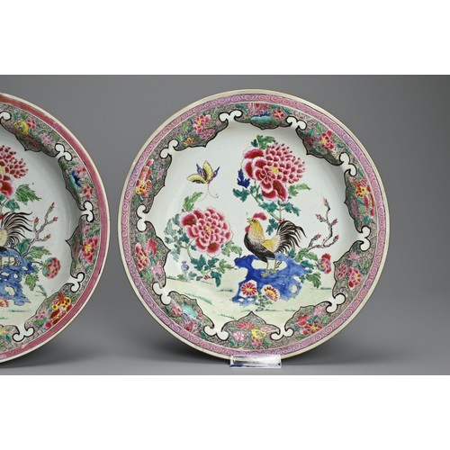 50 - A LARGE PAIR OF CHINESE FAMILLE ROSE PORCELAIN ROOSTER DISHES, EARLY 18TH CENTURY. With rounded side... 