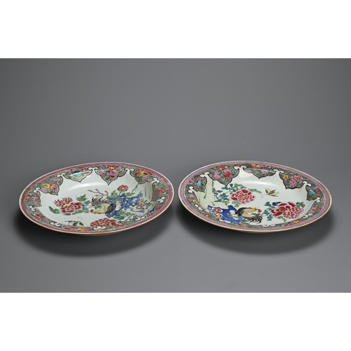 50 - A LARGE PAIR OF CHINESE FAMILLE ROSE PORCELAIN ROOSTER DISHES, EARLY 18TH CENTURY. With rounded side... 