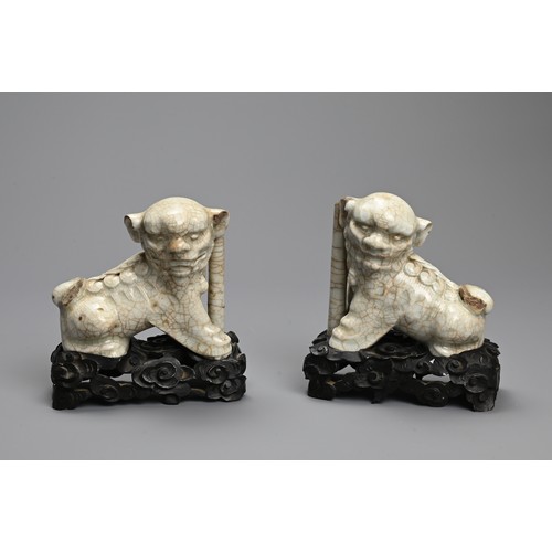 8 - TWO PAIRS OF CHINESE PORCELAIN JOSS STICK HOLDERS, QING DYNASTY. In the form of lion dogs, seated wi... 