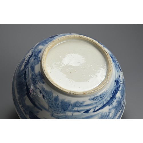 60 - A LARGE CHINESE BLUE AND WHITE PORCELAIN BOWL, 19TH CENTURY. Decorated with figures on a bridge in a... 