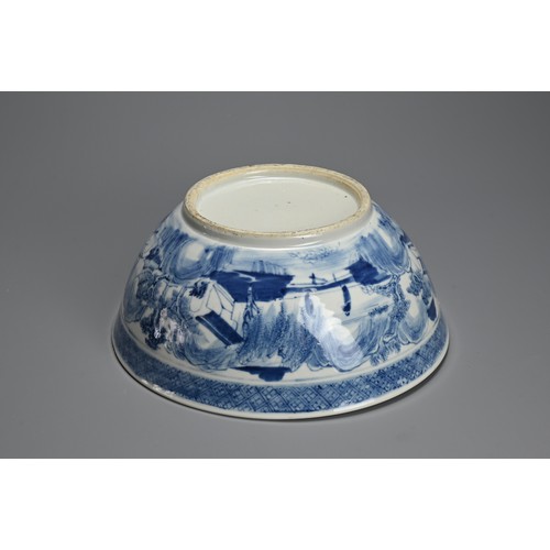 60 - A LARGE CHINESE BLUE AND WHITE PORCELAIN BOWL, 19TH CENTURY. Decorated with figures on a bridge in a... 