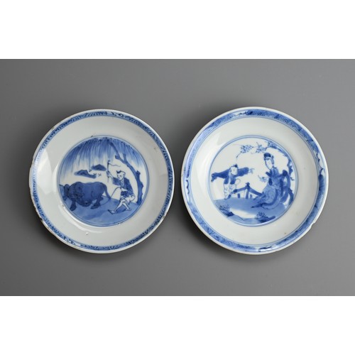 61 - A GROUP OF FOUR CHINESE BLUE AND WHITE PORCELAIN SAUCERS, EARLY 18TH CENTURY. To include a pair depi... 