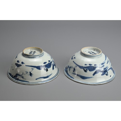 74 - A PAIR OF CHINESE BLUE AND WHITE PORCELAIN BOWLS, MING DYNASTY. Rounded sides with slightly everted ... 