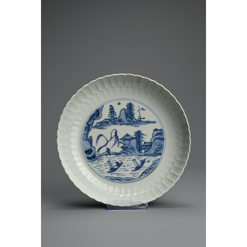 95 - A CHINESE BLUE AND WHITE PORCELAIN DISH, 18TH CENTURY. Finely potted with moulded lappet sides decor... 