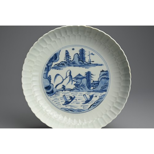 95 - A CHINESE BLUE AND WHITE PORCELAIN DISH, 18TH CENTURY. Finely potted with moulded lappet sides decor... 