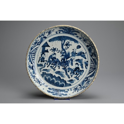 101 - A CHINESE BLUE AND WHITE PORCELAIN DISH, QING DYNASTY. Thickly potted with rounded sides decorated w... 