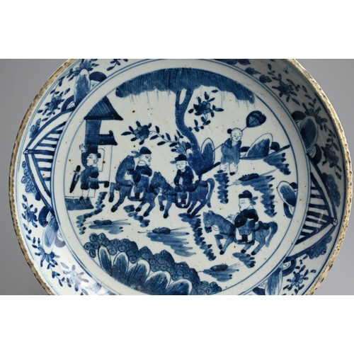 101 - A CHINESE BLUE AND WHITE PORCELAIN DISH, QING DYNASTY. Thickly potted with rounded sides decorated w... 