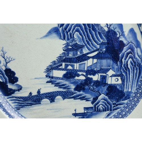 103 - A VERY LARGE CHINESE BLUE AND WHITE PORCELAIN DISH, 18TH CENTURY. Finely decorated with figures cros... 